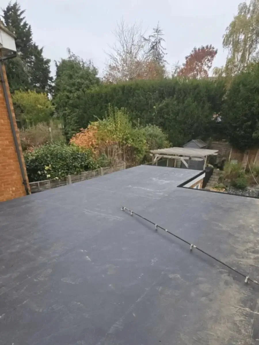 Luxury residential extension featuring integrated glass roof lanterns on a modern, weatherproof flat roof system. Installed by Norfolk Exterior Solutions